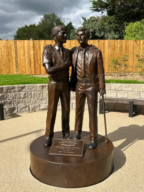 Memorial plaque reading Remembering 122 haemophiliac pupils of Treloar's, infected as children, victims of unethical research. Quote: This disaster was not an accident. Sir Brian Langstaff 20.05.24. Sculptor: Tom Murphy.